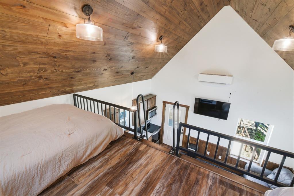 330 Chism Trail Gordon, TX 76453 - Photo 15 of 35 a view of a balcony with wooden floor
