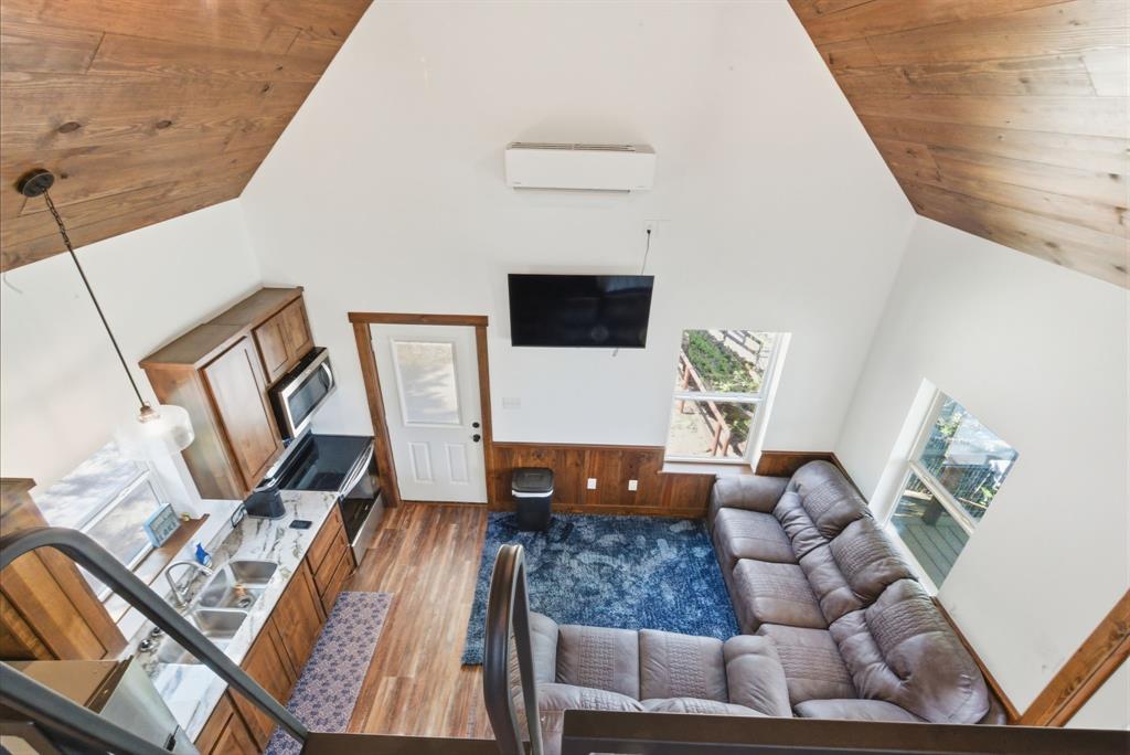330 Chism Trail Gordon, TX 76453 - Photo 6 of 35 a living room with furniture and a flat screen tv