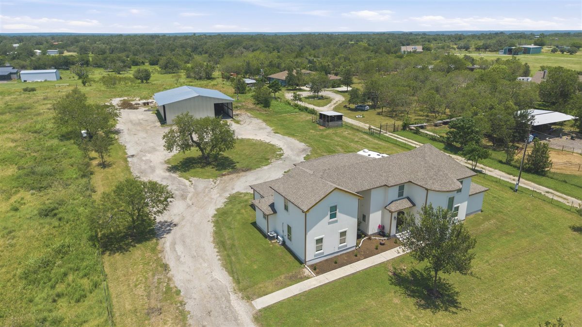 1206 Walter Hoffman Road Cedar Creek, TX 78612 - Photo 2 of 40 View of home and 50ft x 60ft metal building