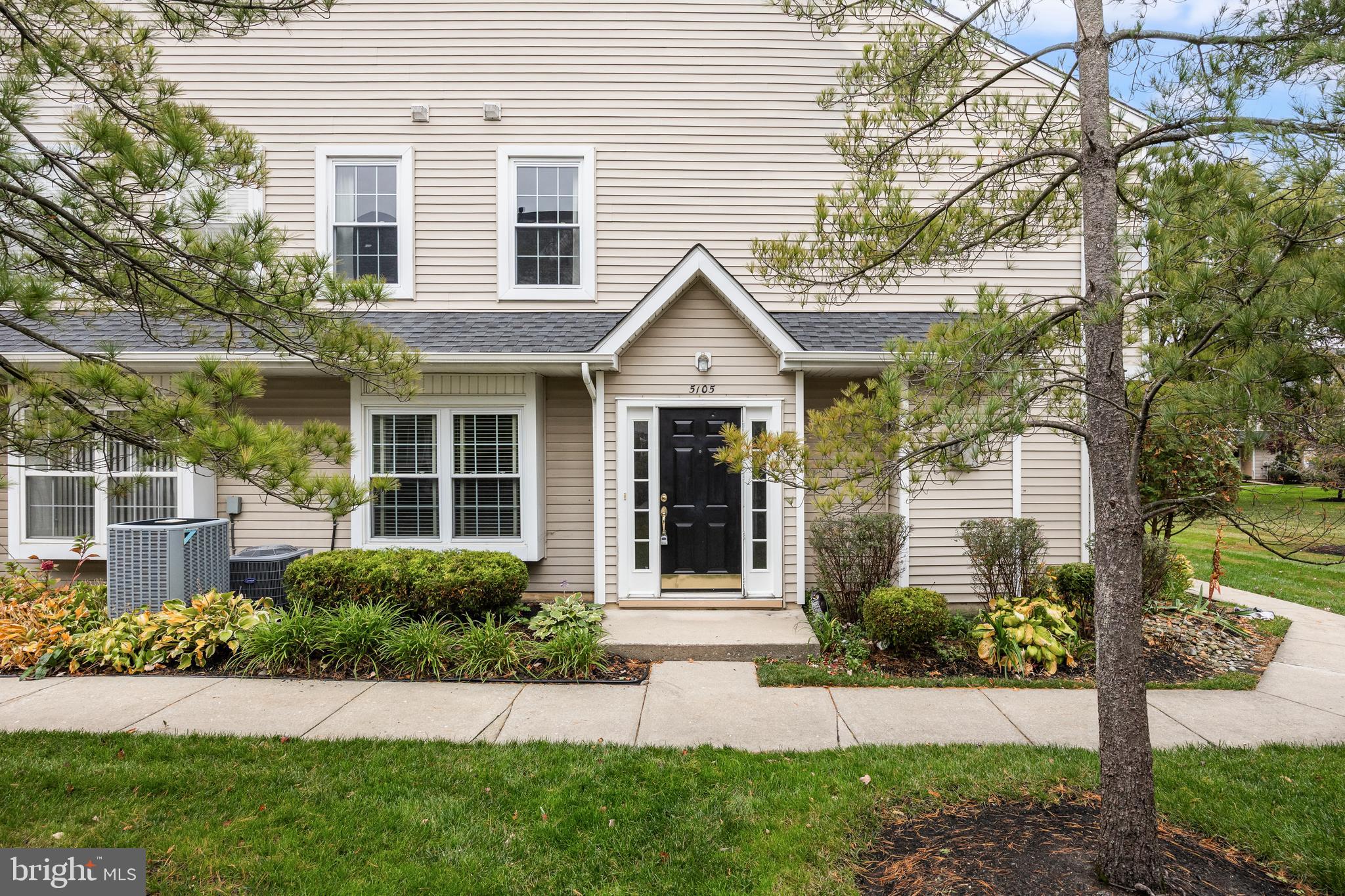 5105 Halifax Way Mount Laurel, NJ 08054 - Photo 1 of 26 a front view of a house with a yard and potted plants