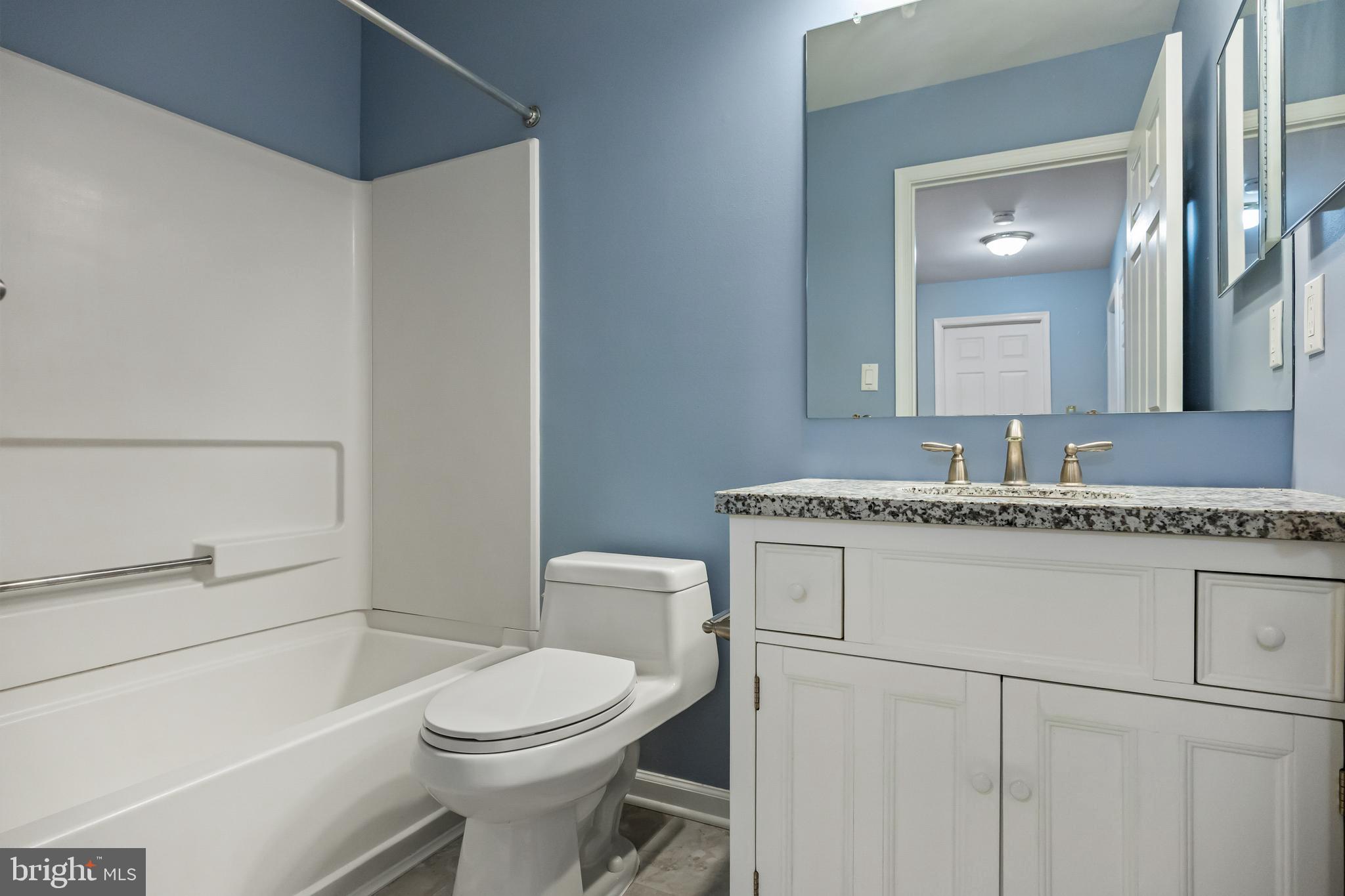 5105 Halifax Way Mount Laurel, NJ 08054 - Photo 20 of 26 a bathroom with a toilet sink and mirror