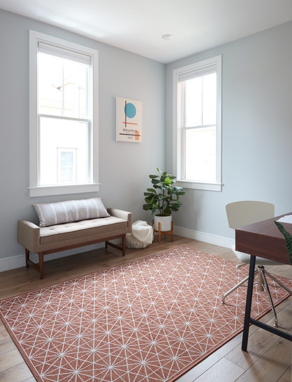 42 Bow Street, Unit 2 Somerville, MA 02143 - Photo 12 of 14 a living room with furniture and a window