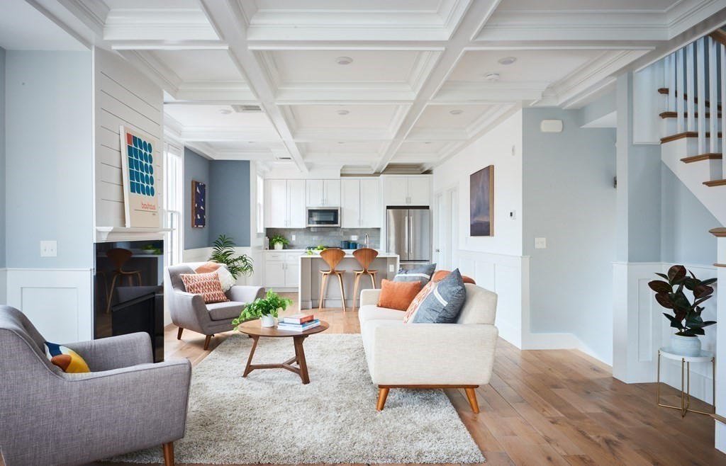 42 Bow Street, Unit 2 Somerville, MA 02143 - Photo 2 of 14 a living room with furniture and a fireplace