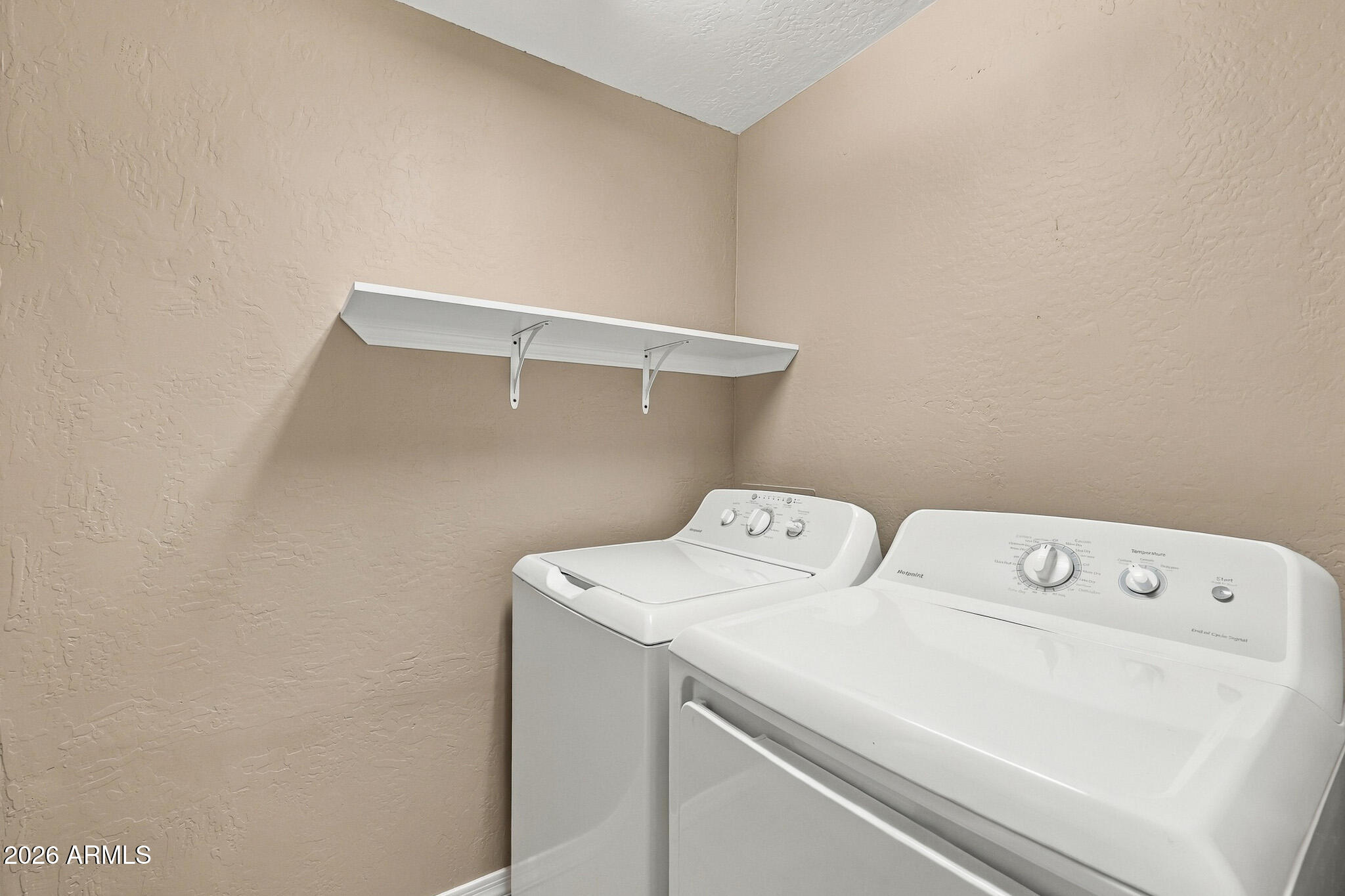 3935 East Rough Rider Road, Unit 1014 Phoenix, AZ 85050 - Photo 24 of 35 Laundry Area