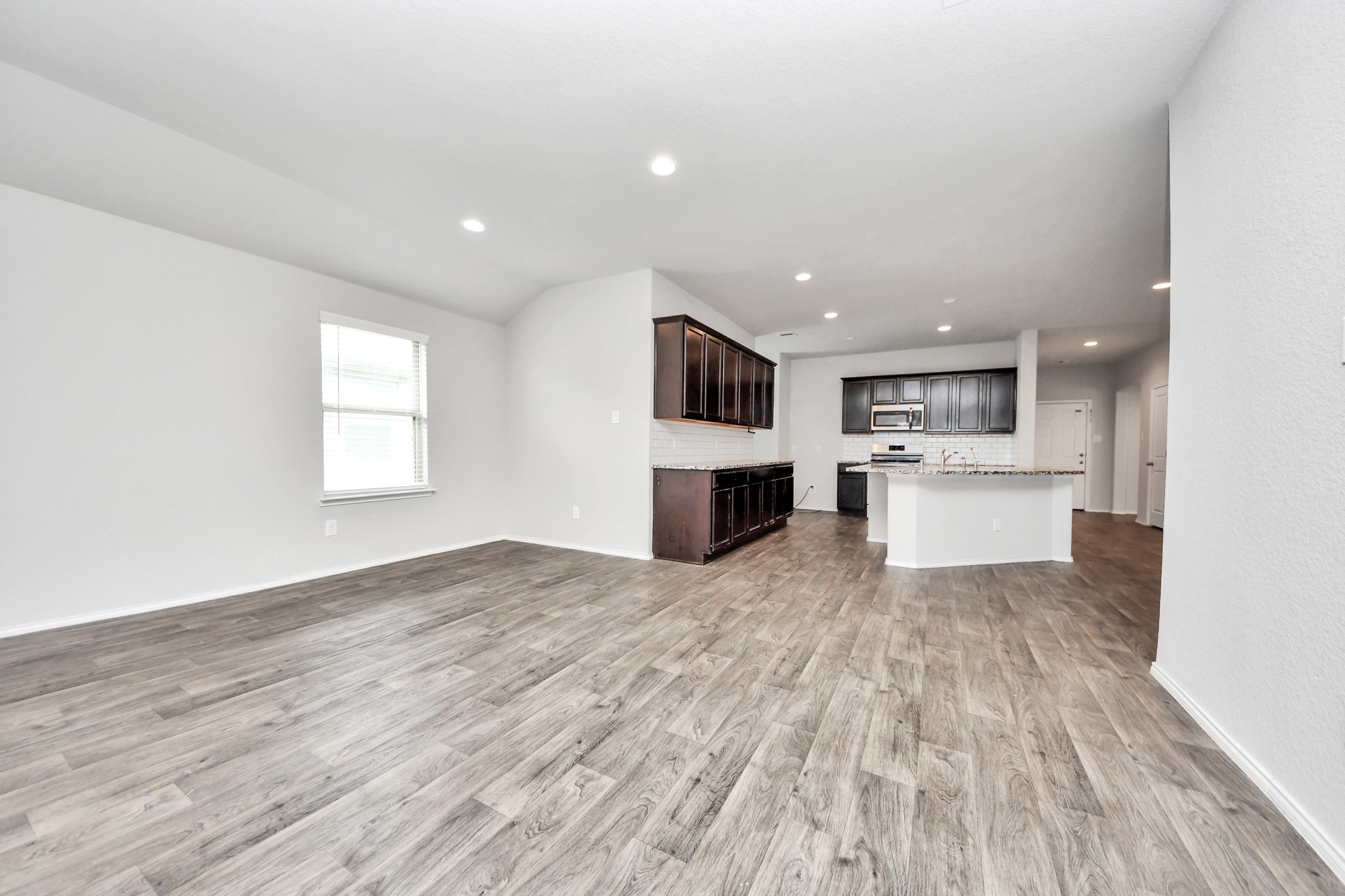 8302 Rose Petals Lane Rosharon, TX 77583 - Photo 6 of 42 Open-concept living and kitchen space