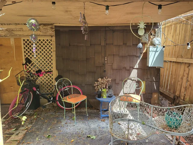 a wooden door with tree in front of it