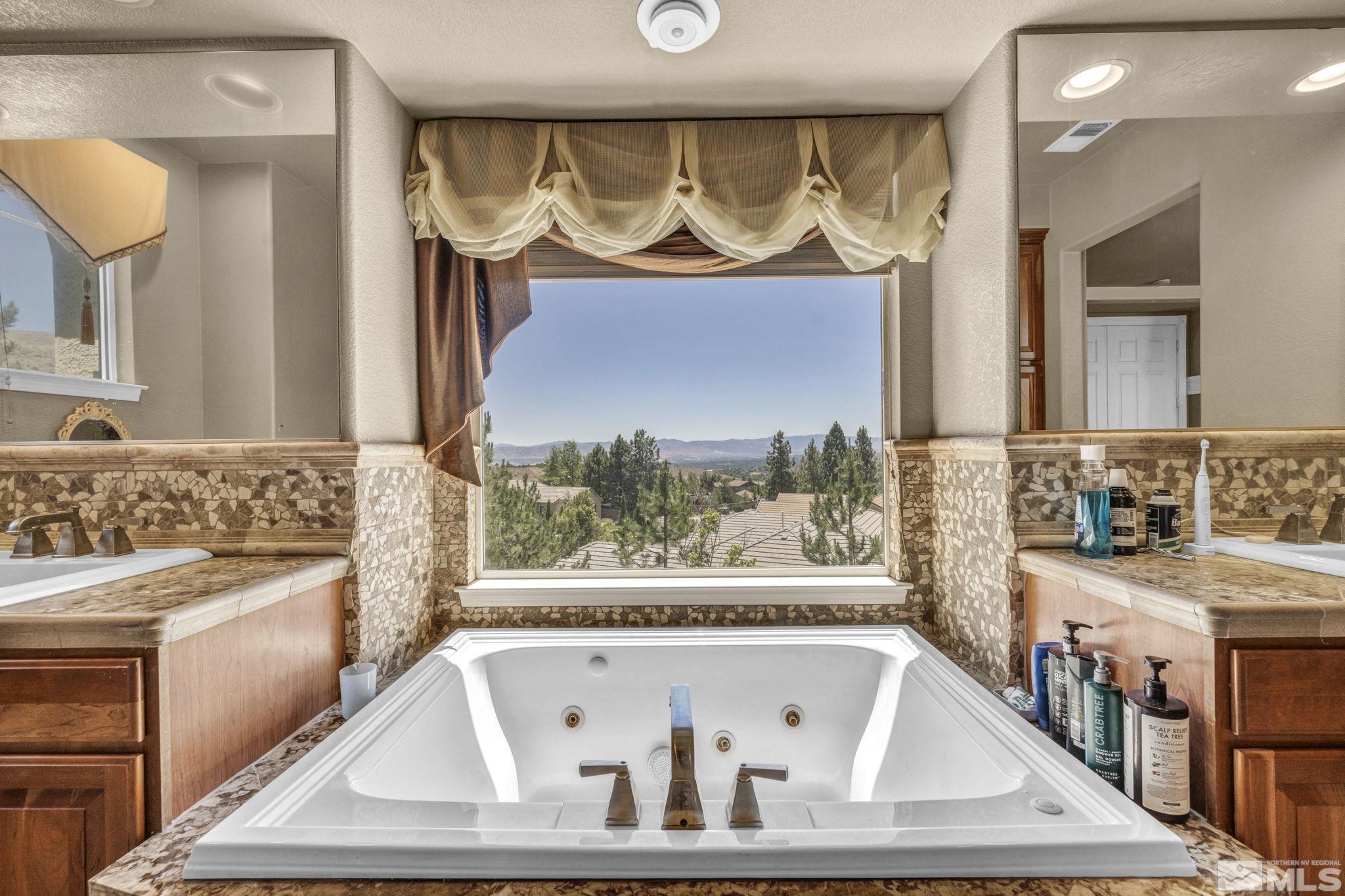 2713 Robb Drive Reno, NV 89523 - Photo 11 of 39 a bathroom with a sink and a bathtub