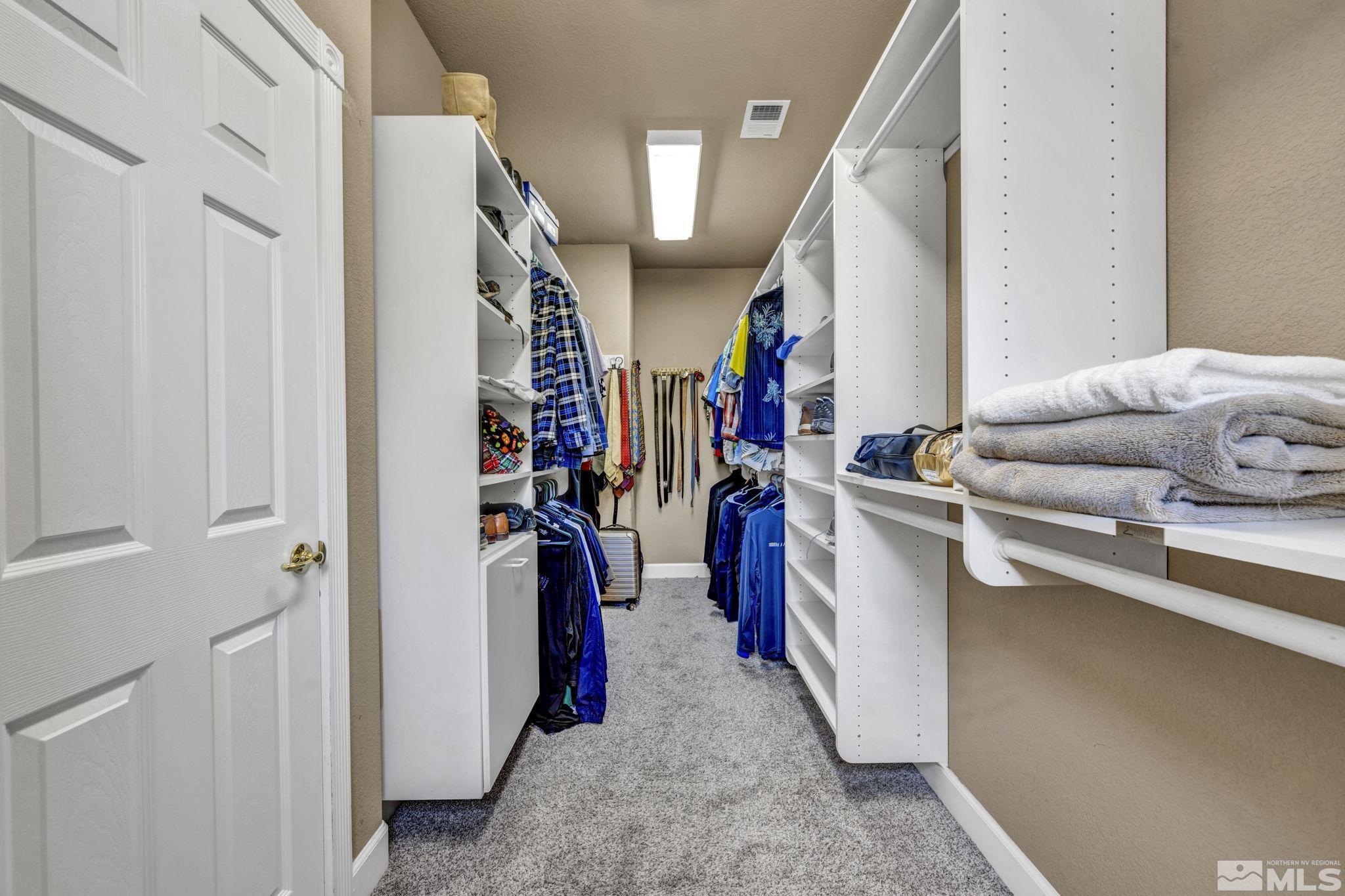 2713 Robb Drive Reno, NV 89523 - Photo 13 of 39 a view of walk in closet with clothes and shoes
