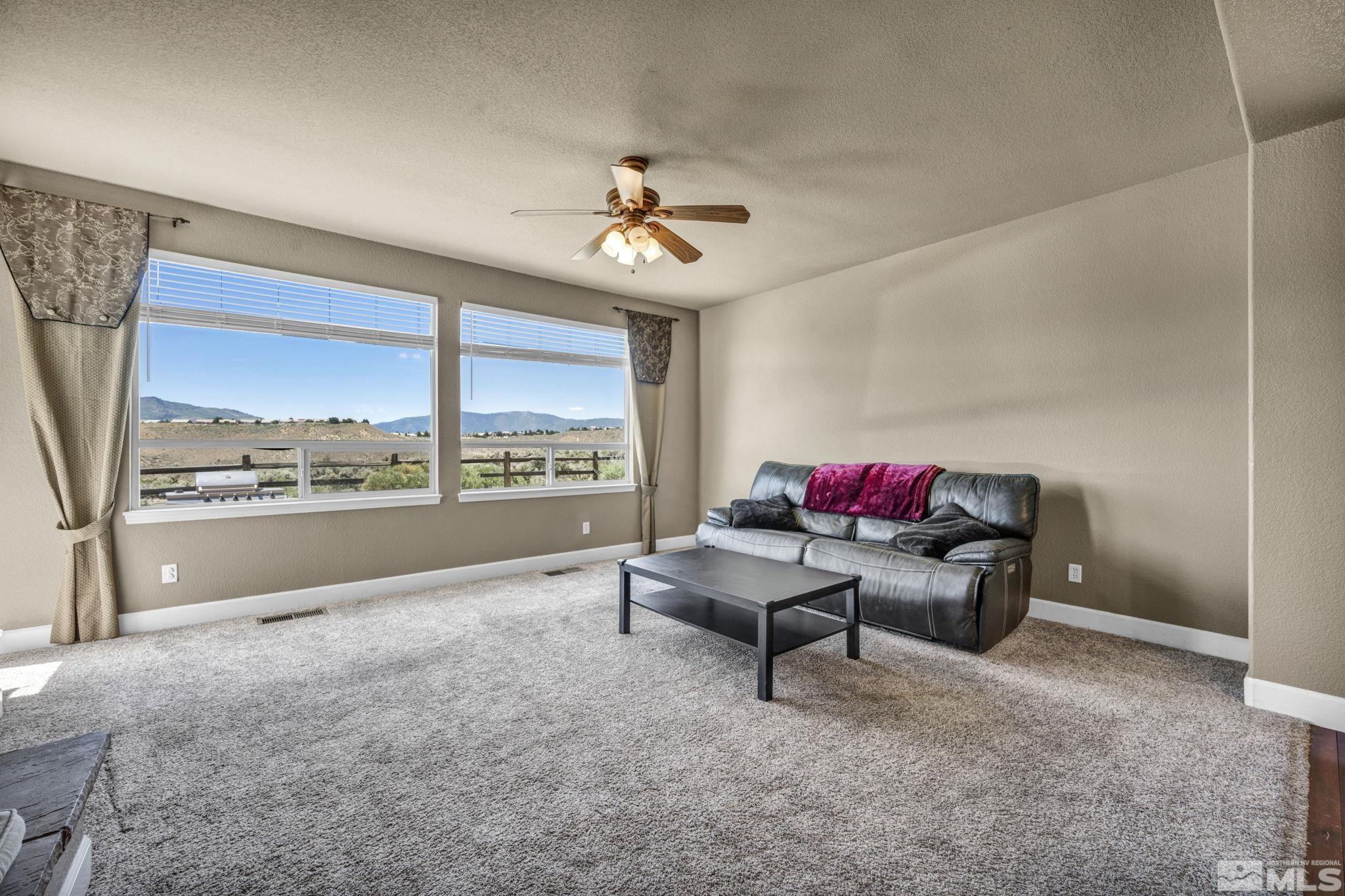 2713 Robb Drive Reno, NV 89523 - Photo 24 of 39 a living room with furniture and a window