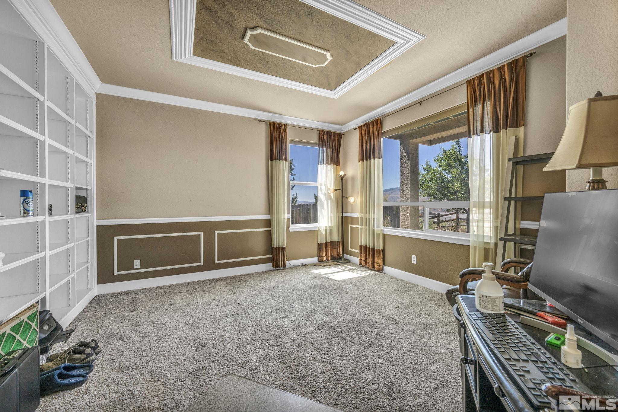 2713 Robb Drive Reno, NV 89523 - Photo 26 of 39 a room with furniture and a flat screen tv