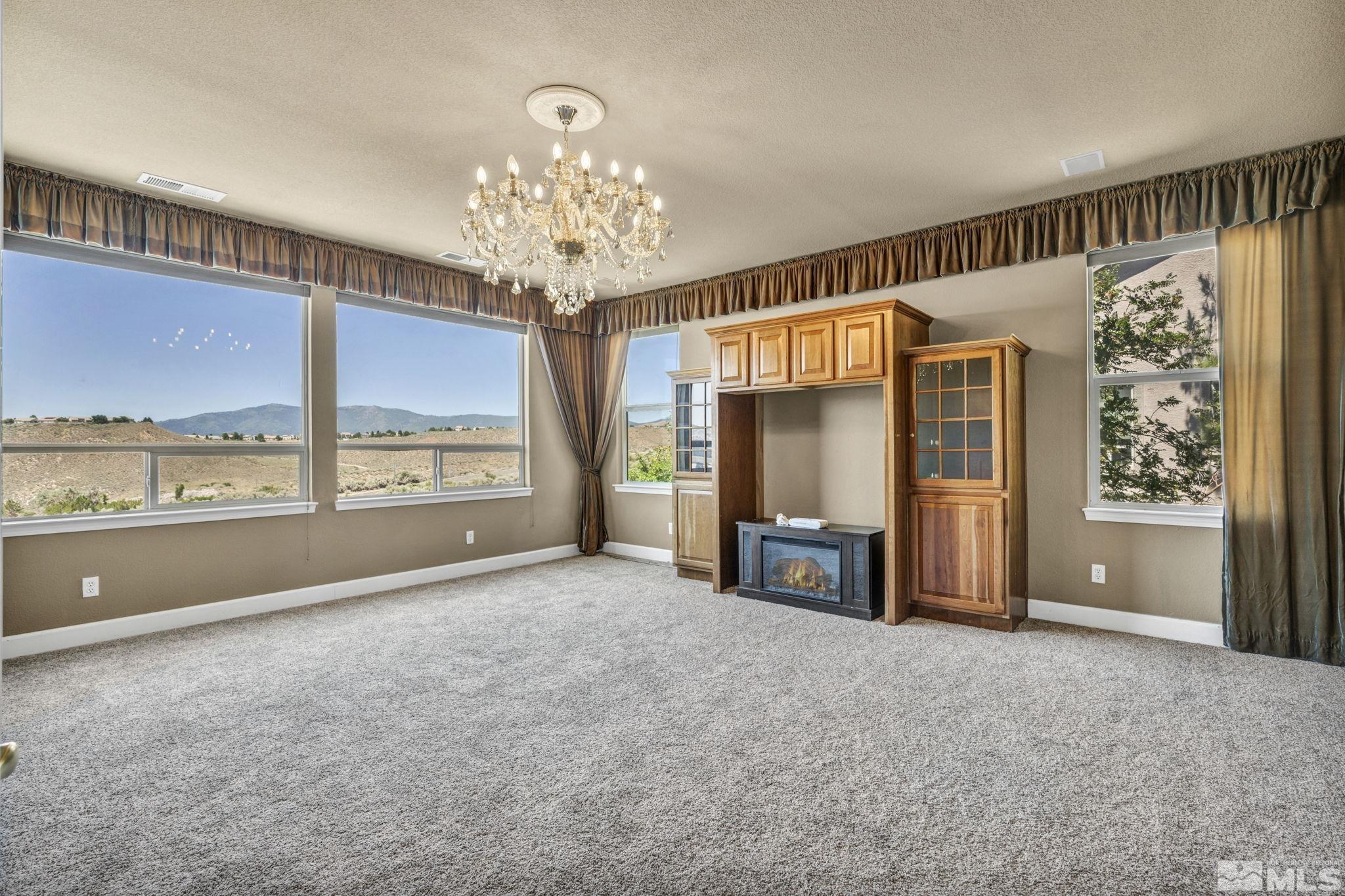 2713 Robb Drive Reno, NV 89523 - Photo 27 of 39 a view of a livingroom with a furniture window and wooden floor