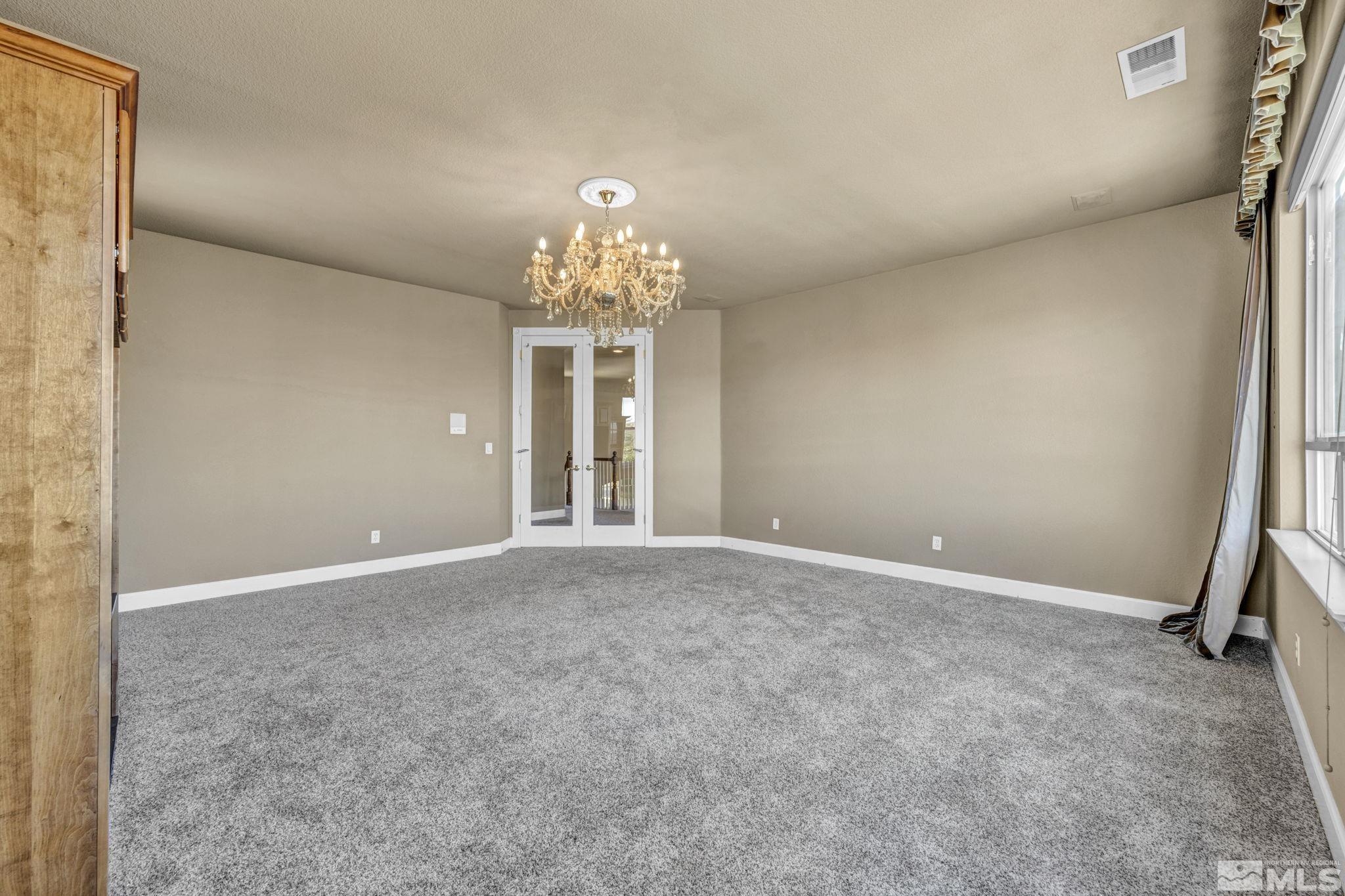 2713 Robb Drive Reno, NV 89523 - Photo 28 of 39 a view of a chandelier and entryway