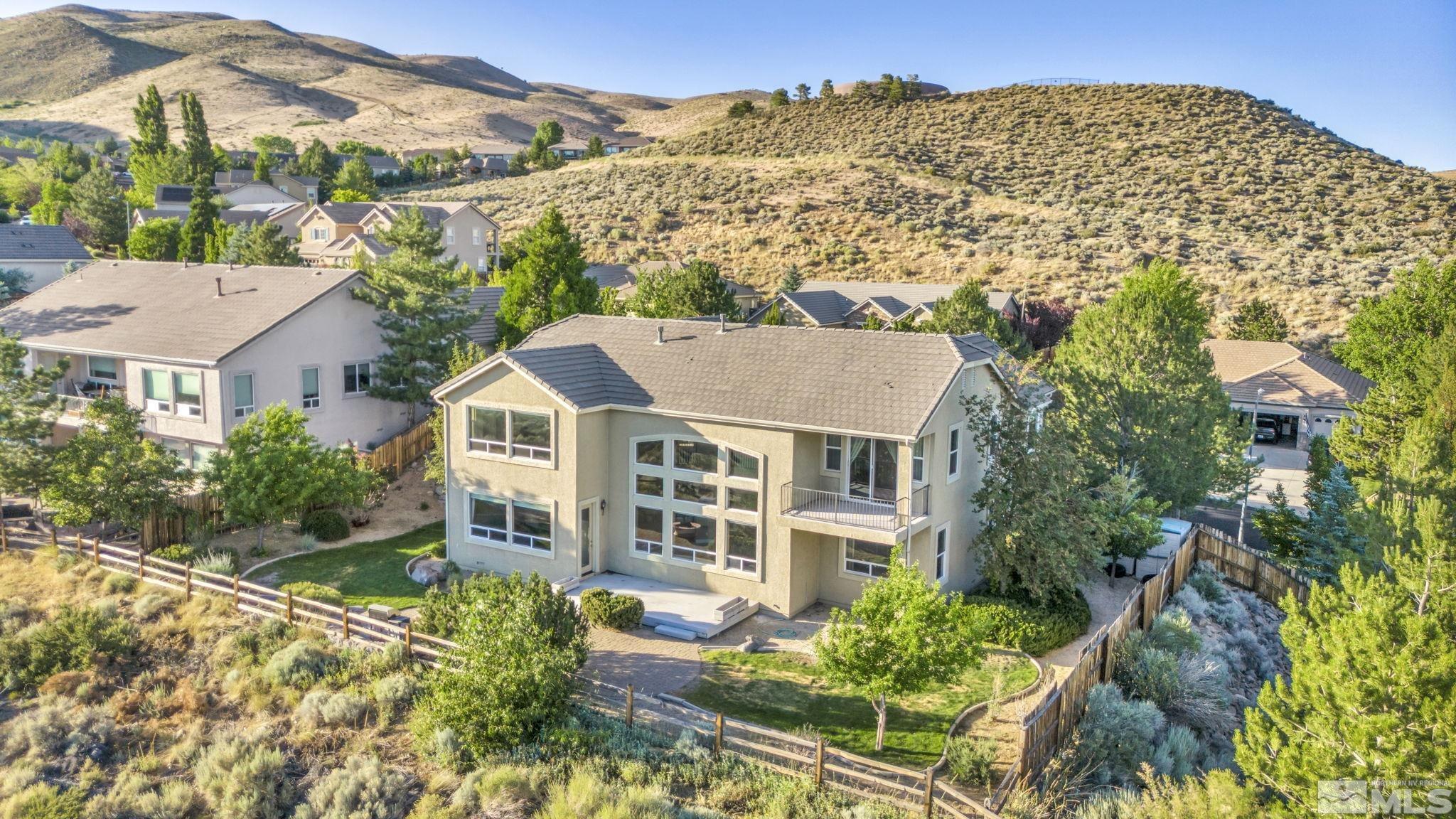 2713 Robb Drive Reno, NV 89523 - Photo 29 of 39 front view of a house with a garden