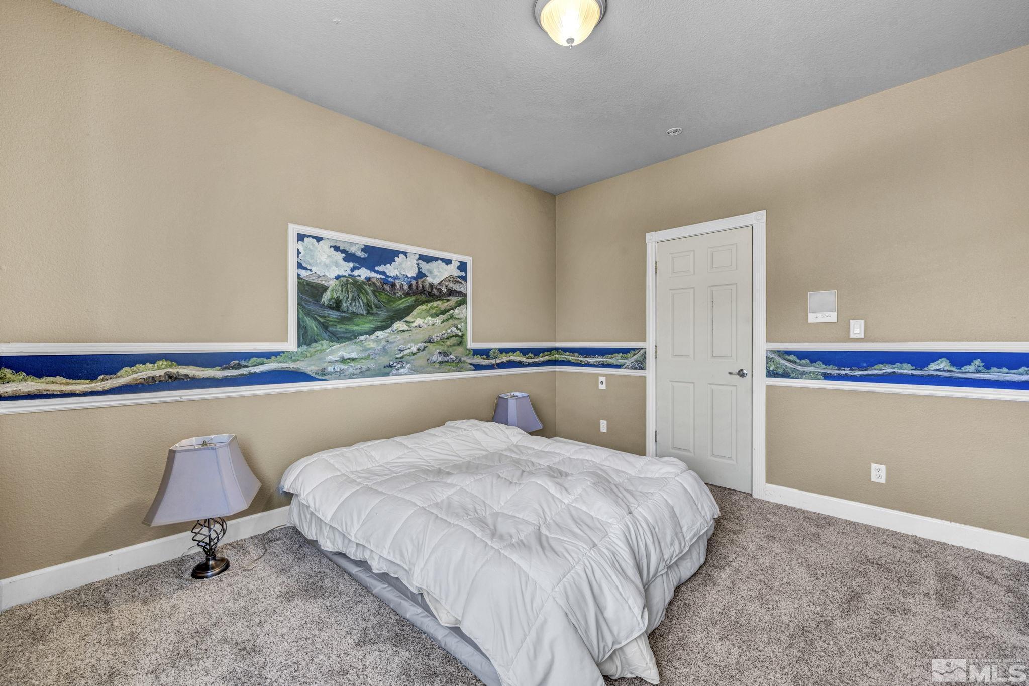2713 Robb Drive Reno, NV 89523 - Photo 36 of 39 a bed room with a bed and painting on the wall