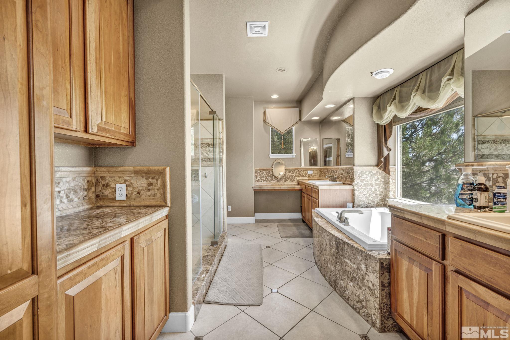 2713 Robb Drive Reno, NV 89523 - Photo 9 of 39 a kitchen with stainless steel appliances granite countertop a sink and cabinets