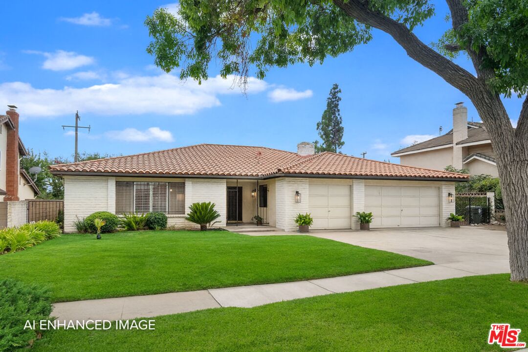 882 West 17th Street Upland, CA 91784 - Photo 1 of 27 a front view of a house with a yard and potted plants