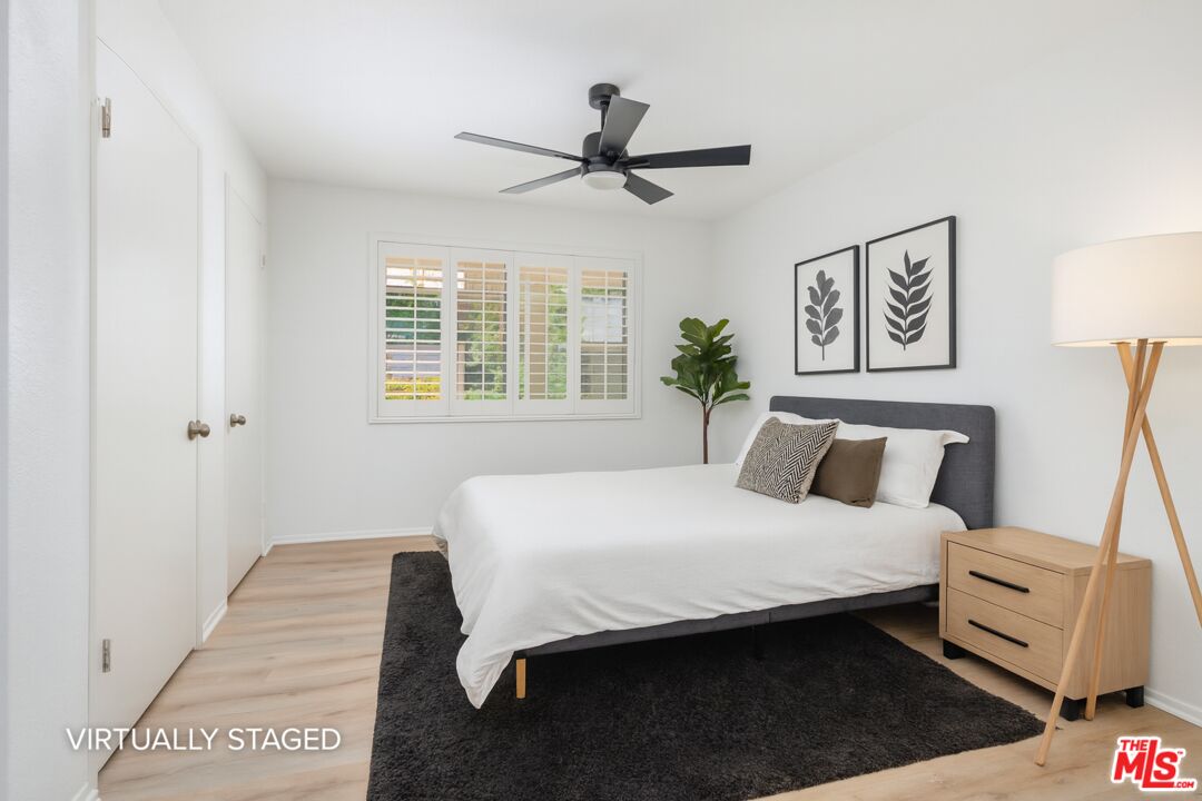 882 West 17th Street Upland, CA 91784 - Photo 15 of 27 a bedroom with a bed and a window