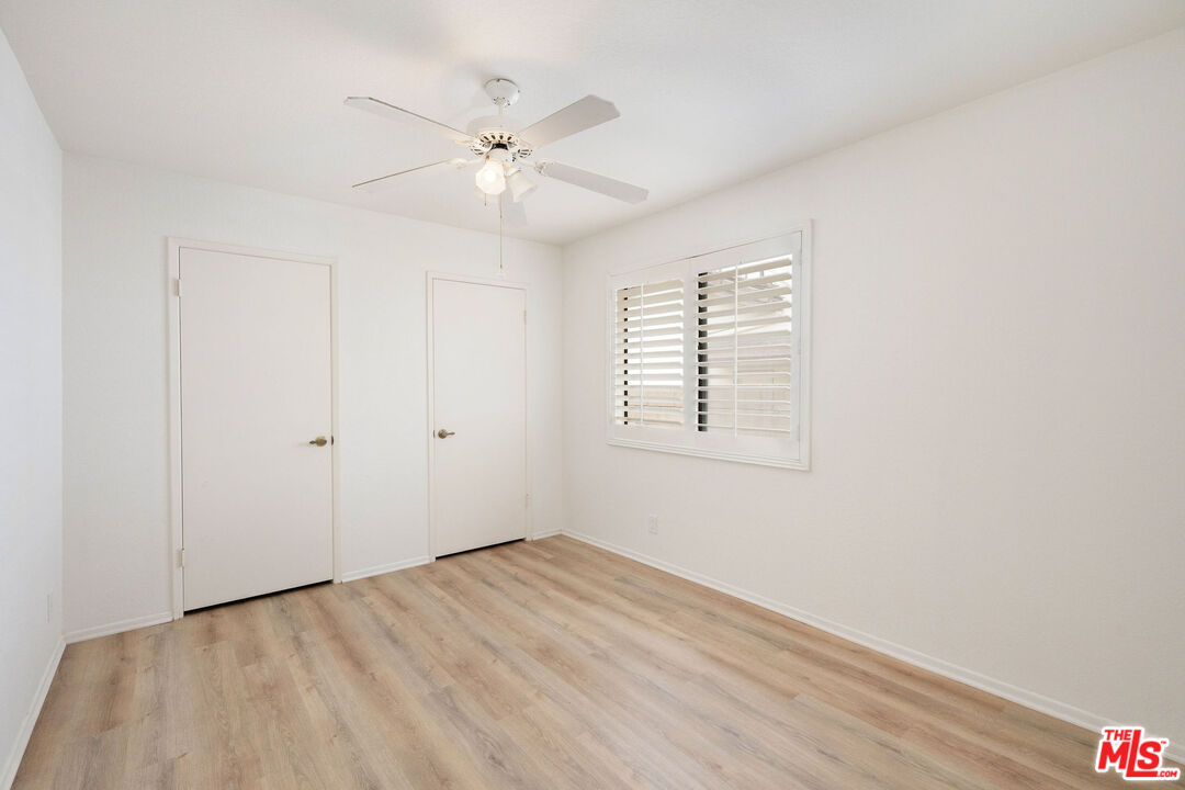 882 West 17th Street Upland, CA 91784 - Photo 17 of 27 wooden floor in an empty room with a window
