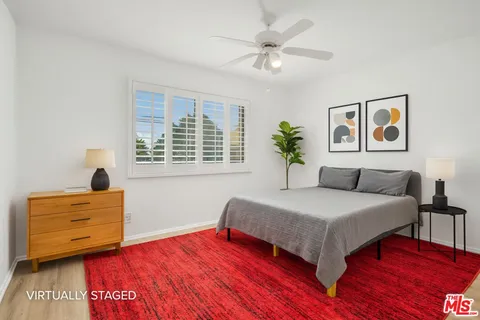 a spacious bedroom with a bed and a table