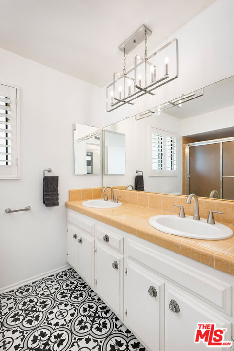 882 West 17th Street Upland, CA 91784 - Photo 20 of 27 a bathroom with a sink and a mirror