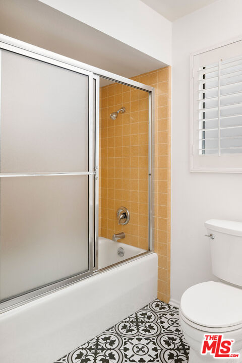 882 West 17th Street Upland, CA 91784 - Photo 21 of 27 a bathroom with a toilet and a shower