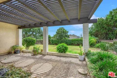 a garden view with a seating space