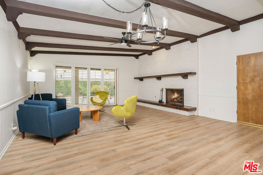 882 West 17th Street Upland, CA 91784 - Photo 4 of 27 a living room with furniture and a fireplace