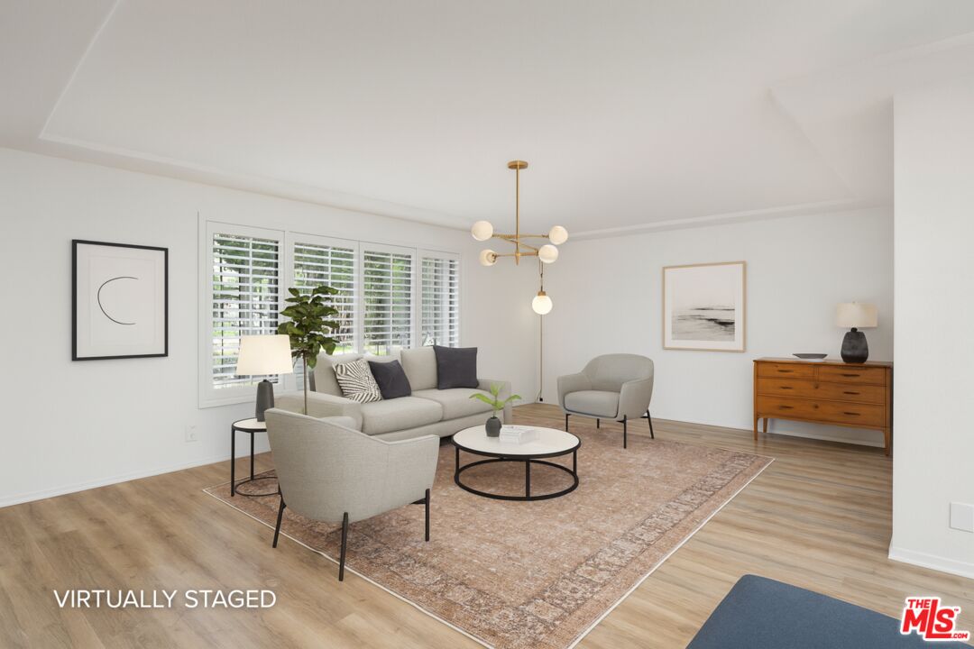 882 West 17th Street Upland, CA 91784 - Photo 5 of 27 a living room with furniture and wooden floor