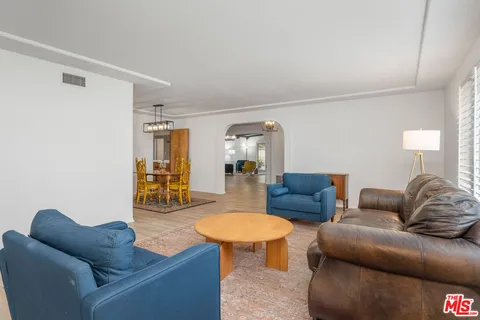 a living room with furniture and a table