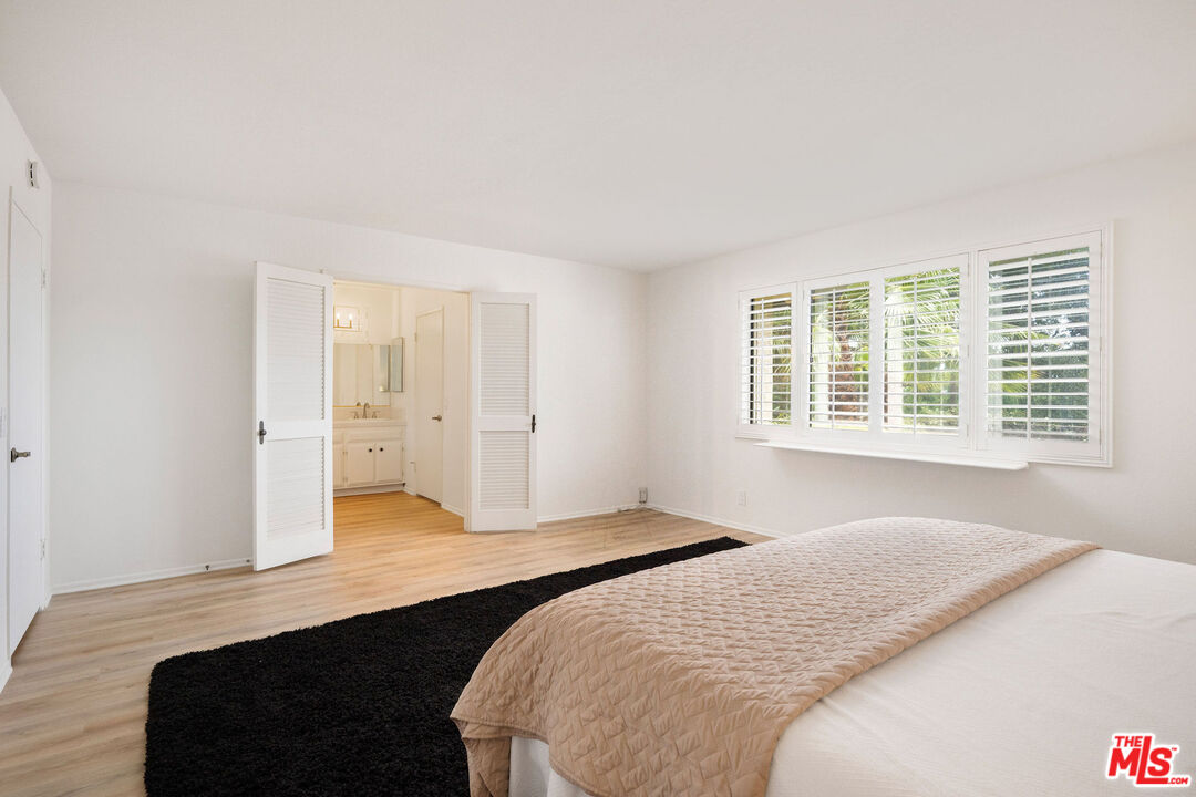 882 West 17th Street Upland, CA 91784 - Photo 10 of 27 a bedroom with a bed and a window