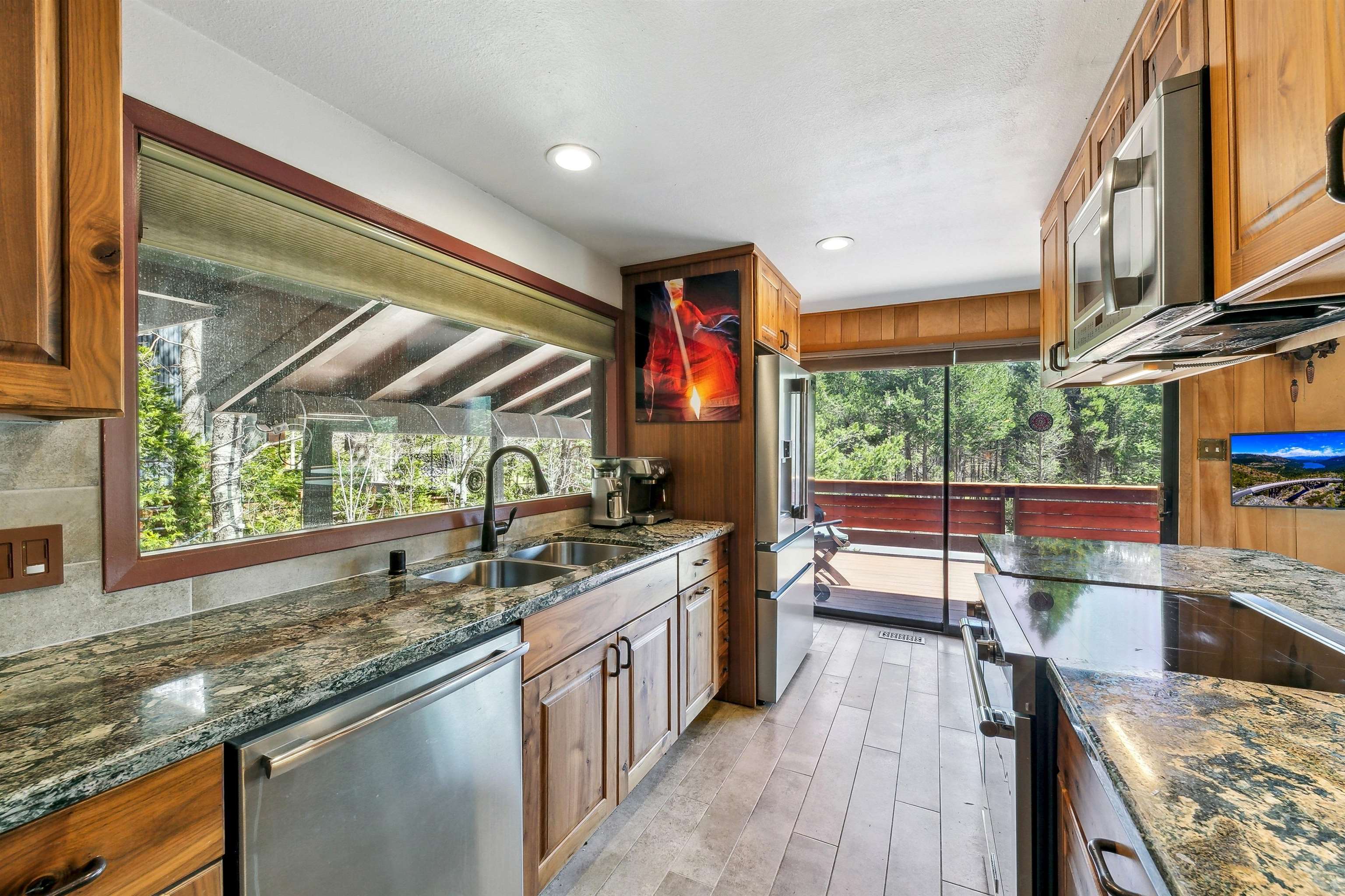 720 Olympic Vly Road Olympic Valley, CA 96146 - Photo 11 of 28 a kitchen with stainless steel appliances granite countertop sink stove and cabinets