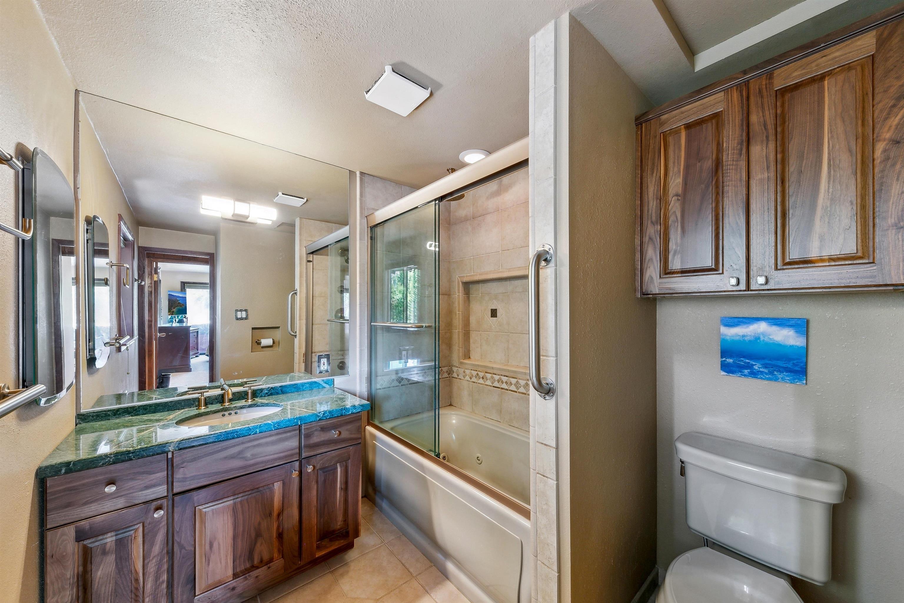 720 Olympic Vly Road Olympic Valley, CA 96146 - Photo 16 of 28 a bathroom with a granite countertop tub sink and mirror