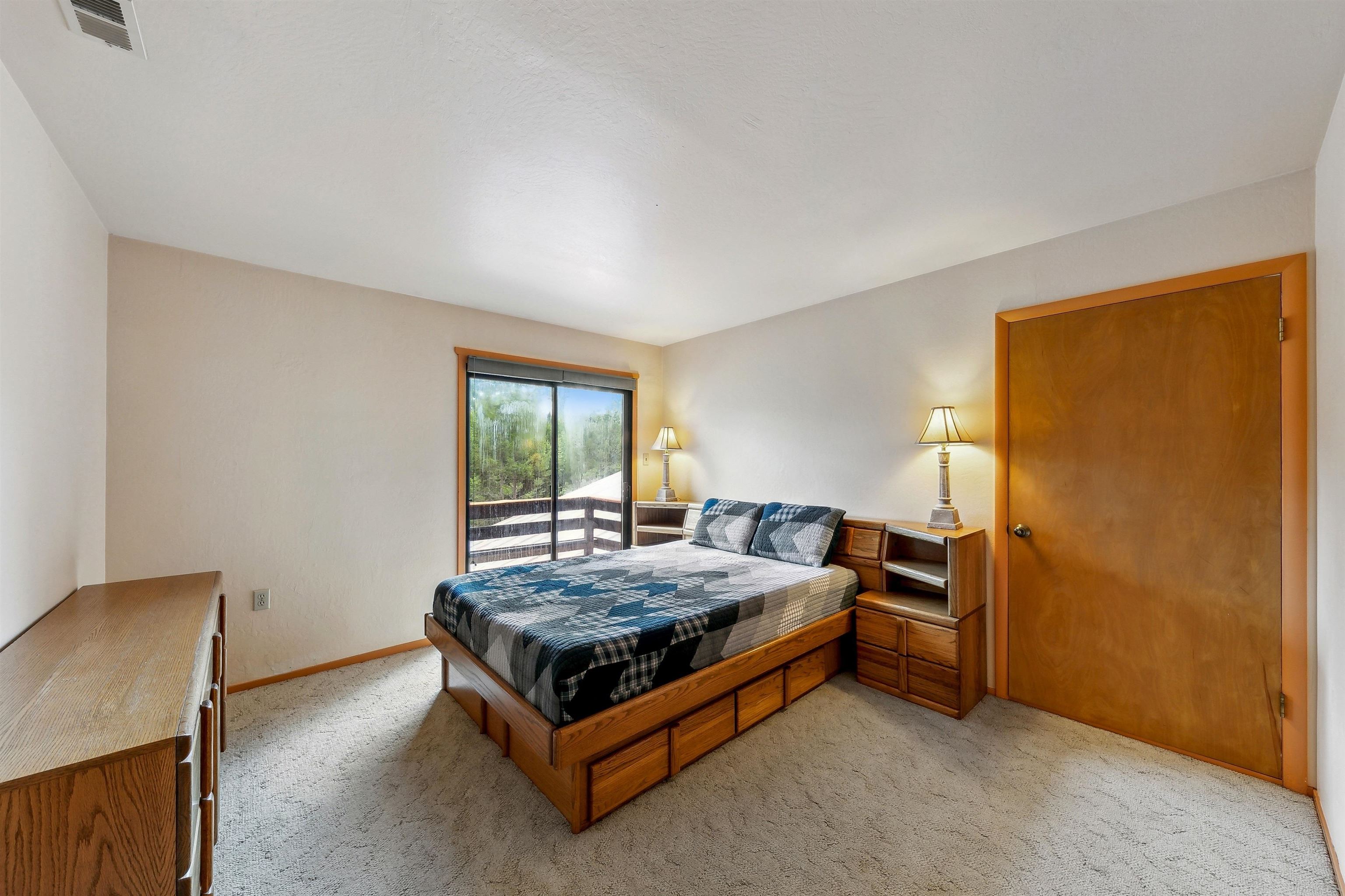 720 Olympic Vly Road Olympic Valley, CA 96146 - Photo 17 of 28 a bedroom with a bed and window