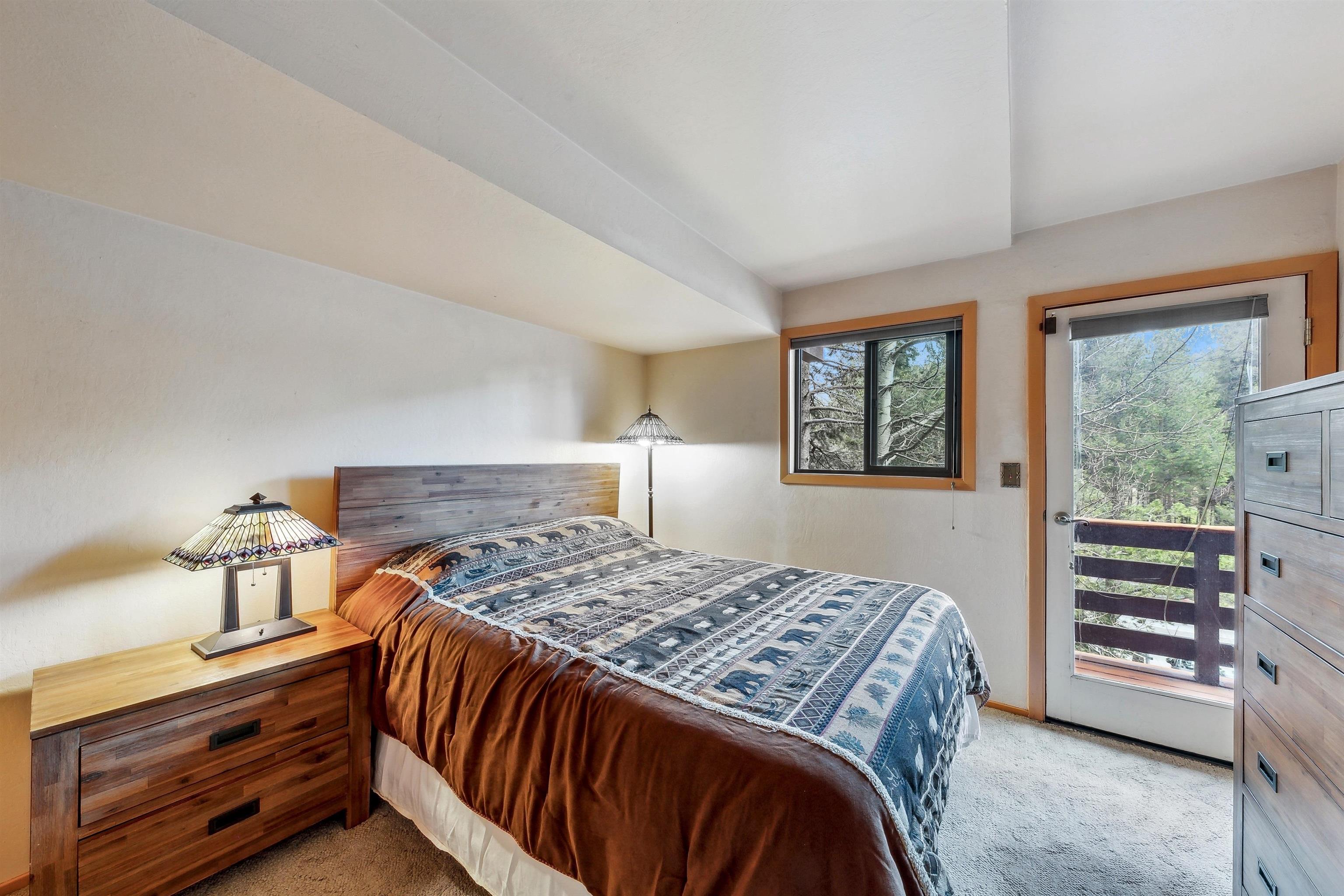 720 Olympic Vly Road Olympic Valley, CA 96146 - Photo 22 of 28 a bedroom with a bed and a dresser
