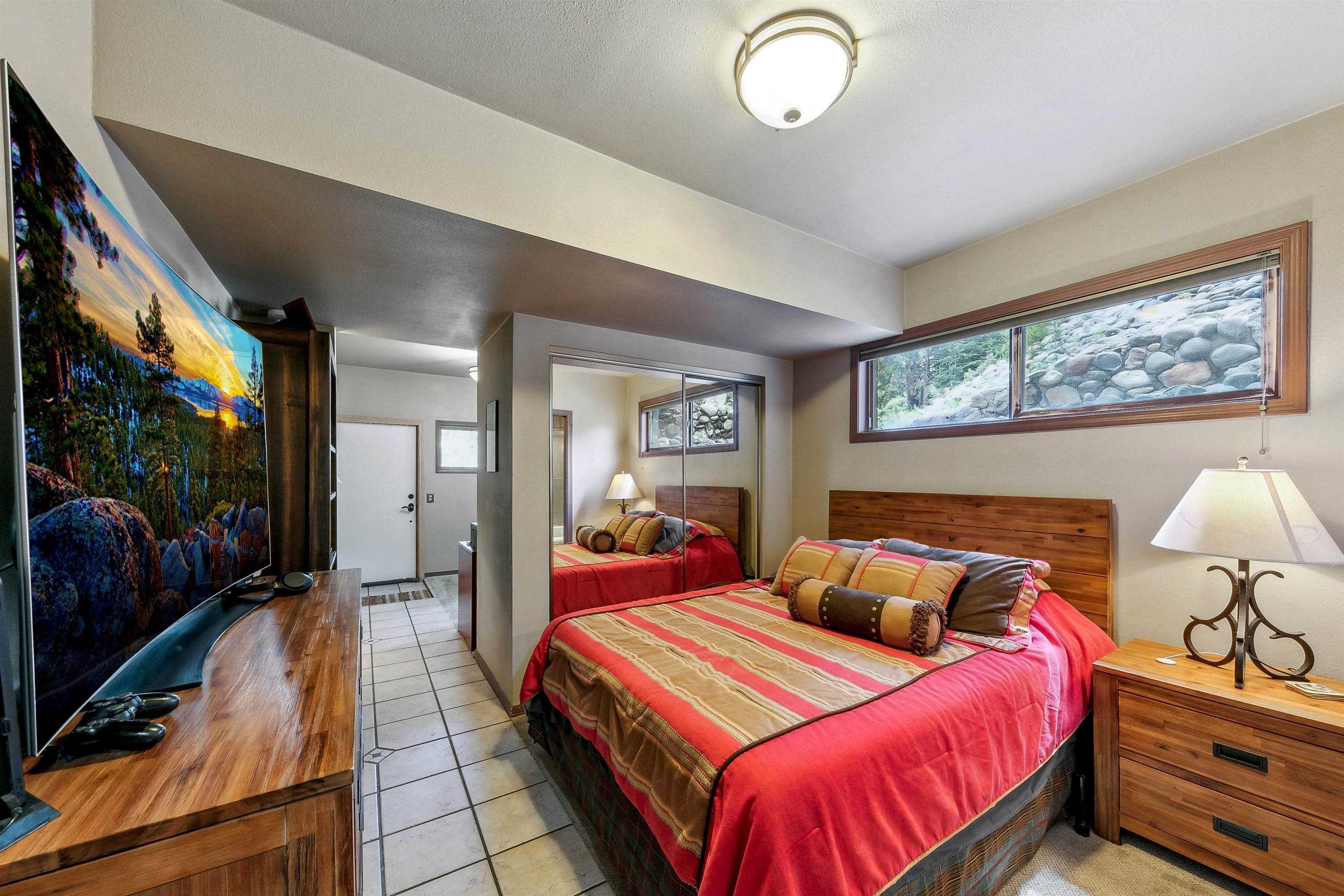 720 Olympic Vly Road Olympic Valley, CA 96146 - Photo 23 of 28 a bedroom with two beds and a chandelier