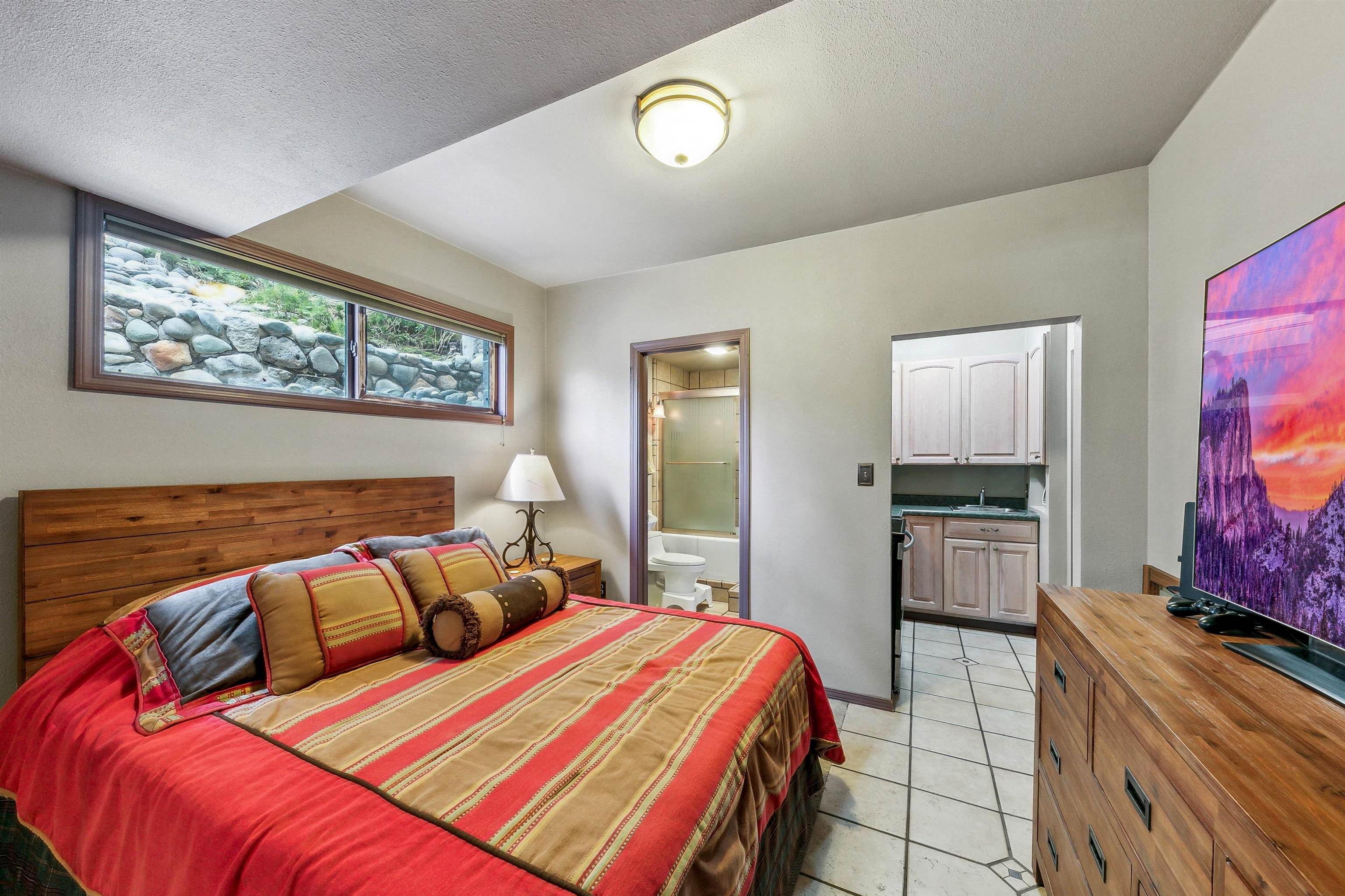 720 Olympic Vly Road Olympic Valley, CA 96146 - Photo 25 of 28 a bedroom with a bed and a flat screen tv