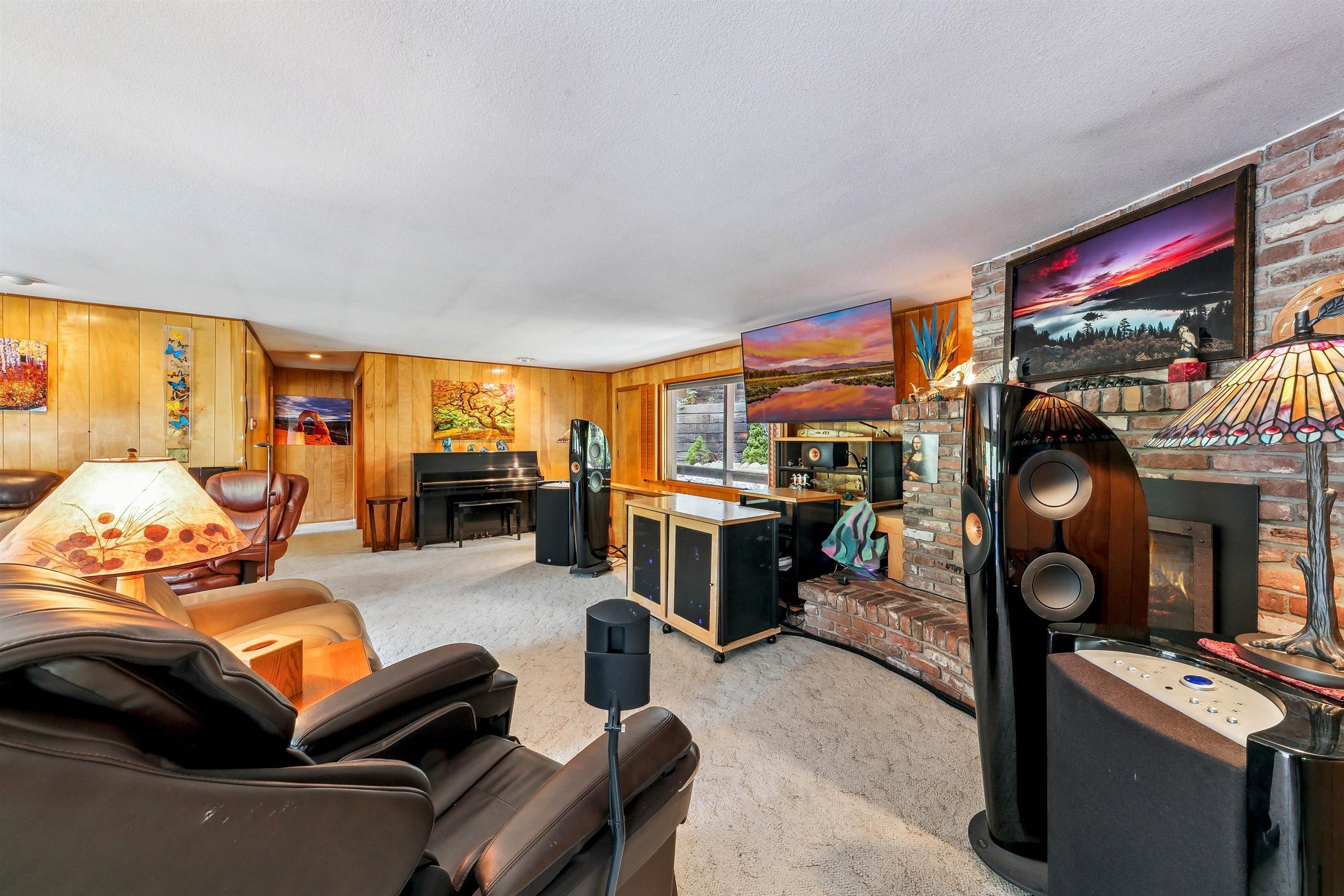 720 Olympic Vly Road Olympic Valley, CA 96146 - Photo 8 of 28 a living room with furniture a flat screen tv and kitchen view