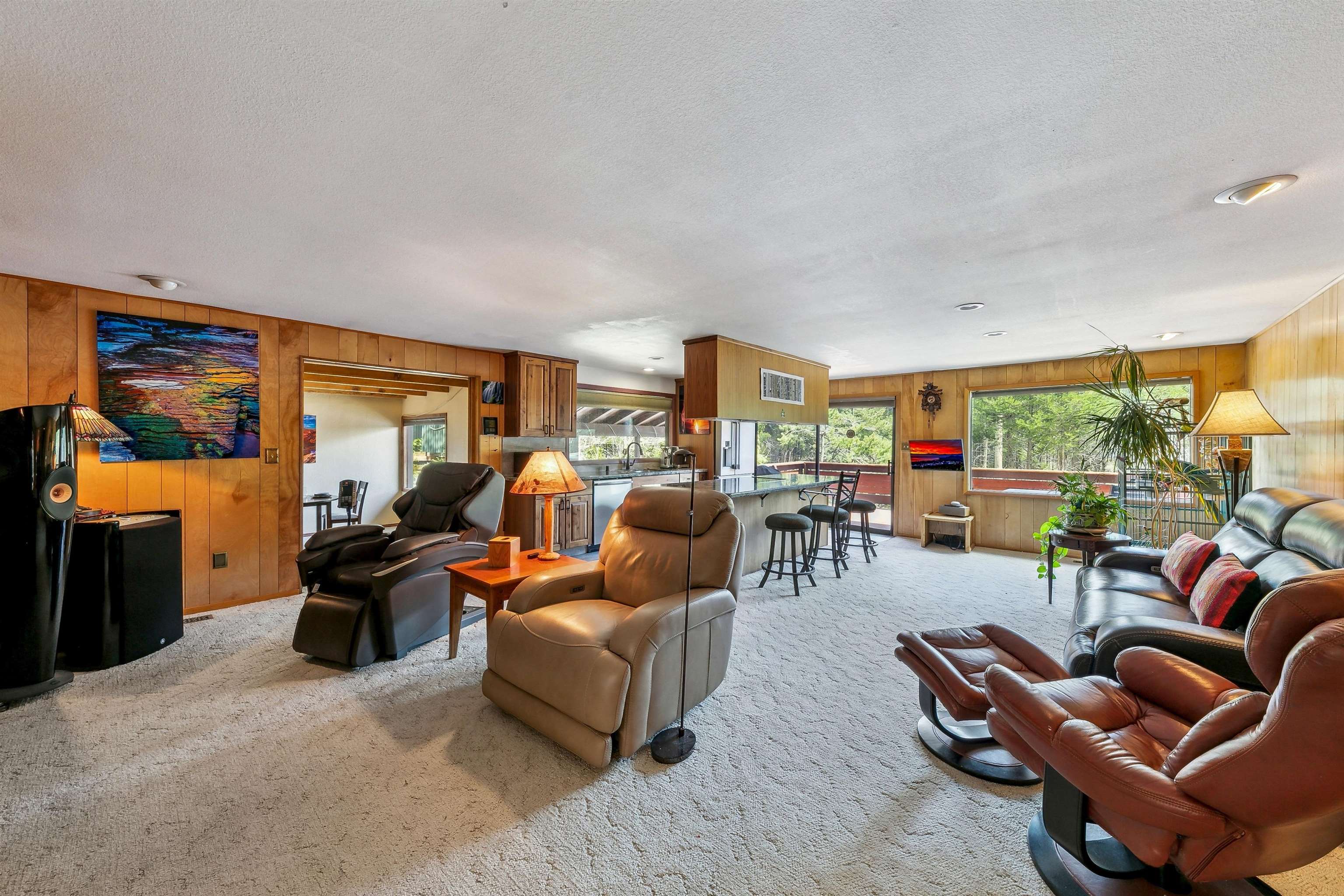 720 Olympic Vly Road Olympic Valley, CA 96146 - Photo 9 of 28 a living room with furniture a fireplace and a large window