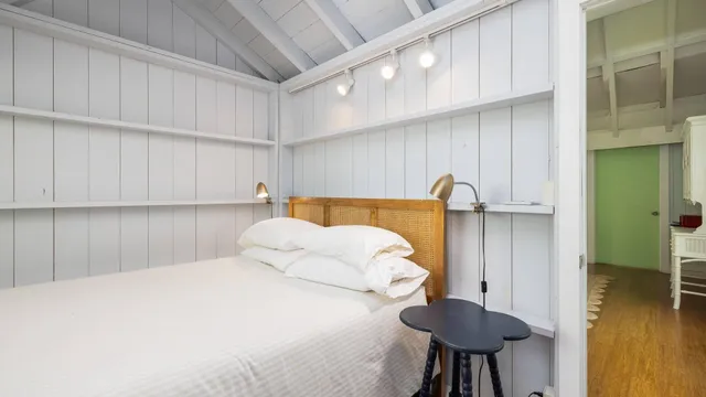 a bedroom with a bed and a table in it