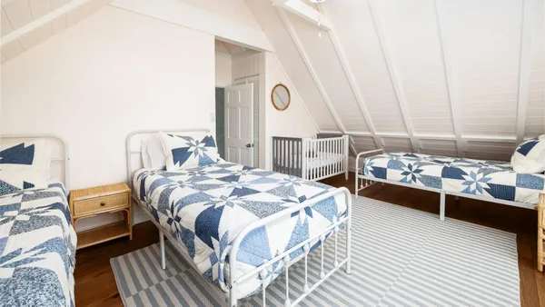 a bedroom with a bed and a table
