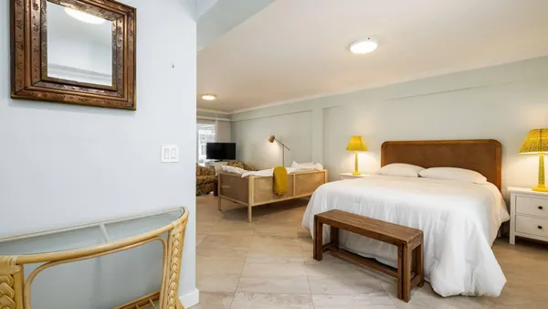 a bedroom with bed and window
