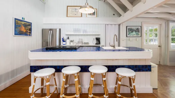 a dining room with wooden floor and breakfast area