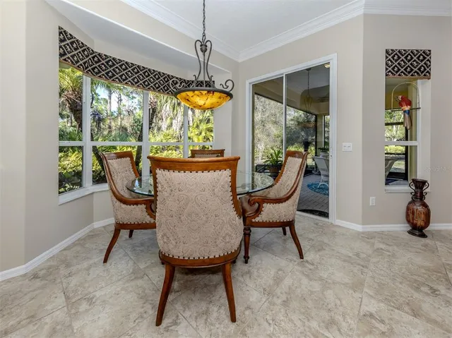 a spacious bathroom with a granite countertop tub sink a mirror a bathtub and a shower