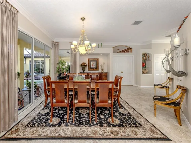 a bathroom with a granite countertop bathtub shower sink vanity and toilet