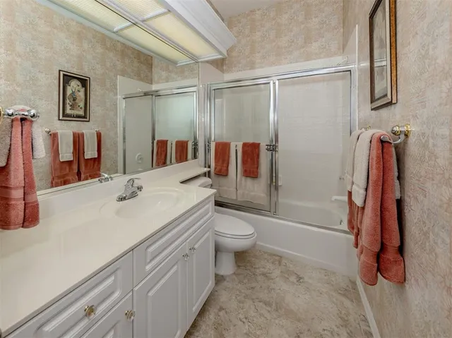 a bed room with two beds and a window