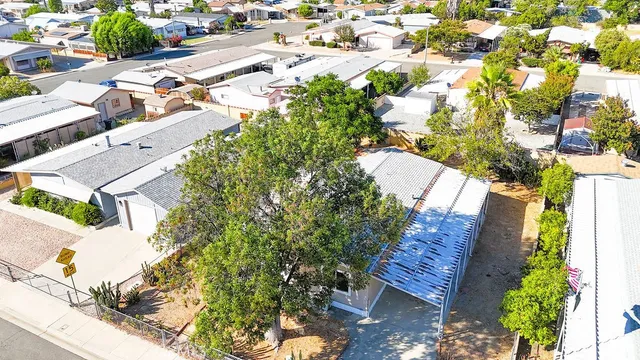 an aerial view of residential houses with outdoor space