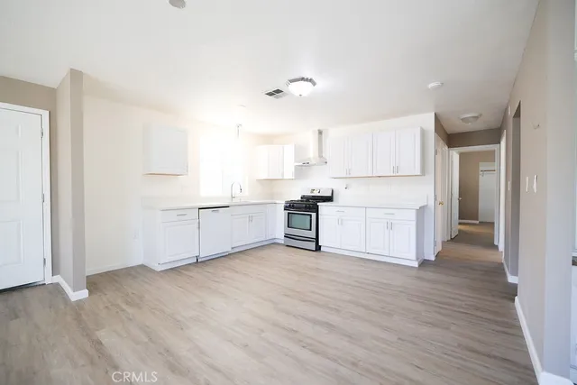 a view of kitchen with wooden floor