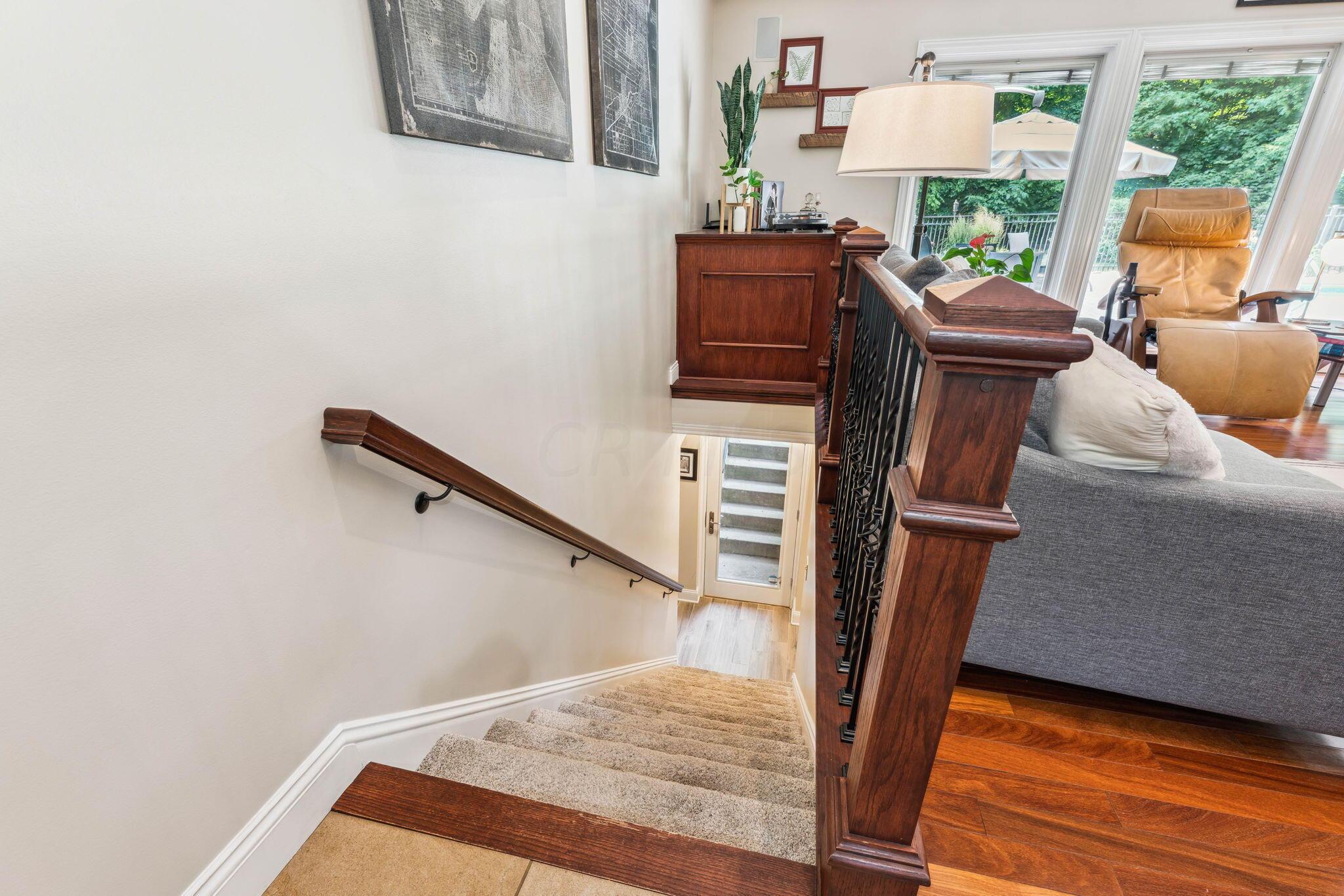 2423 Carriage Road Powell, OH 43065 - Photo 47 of 100 Wrought iron staircase leads to the finished lower level!