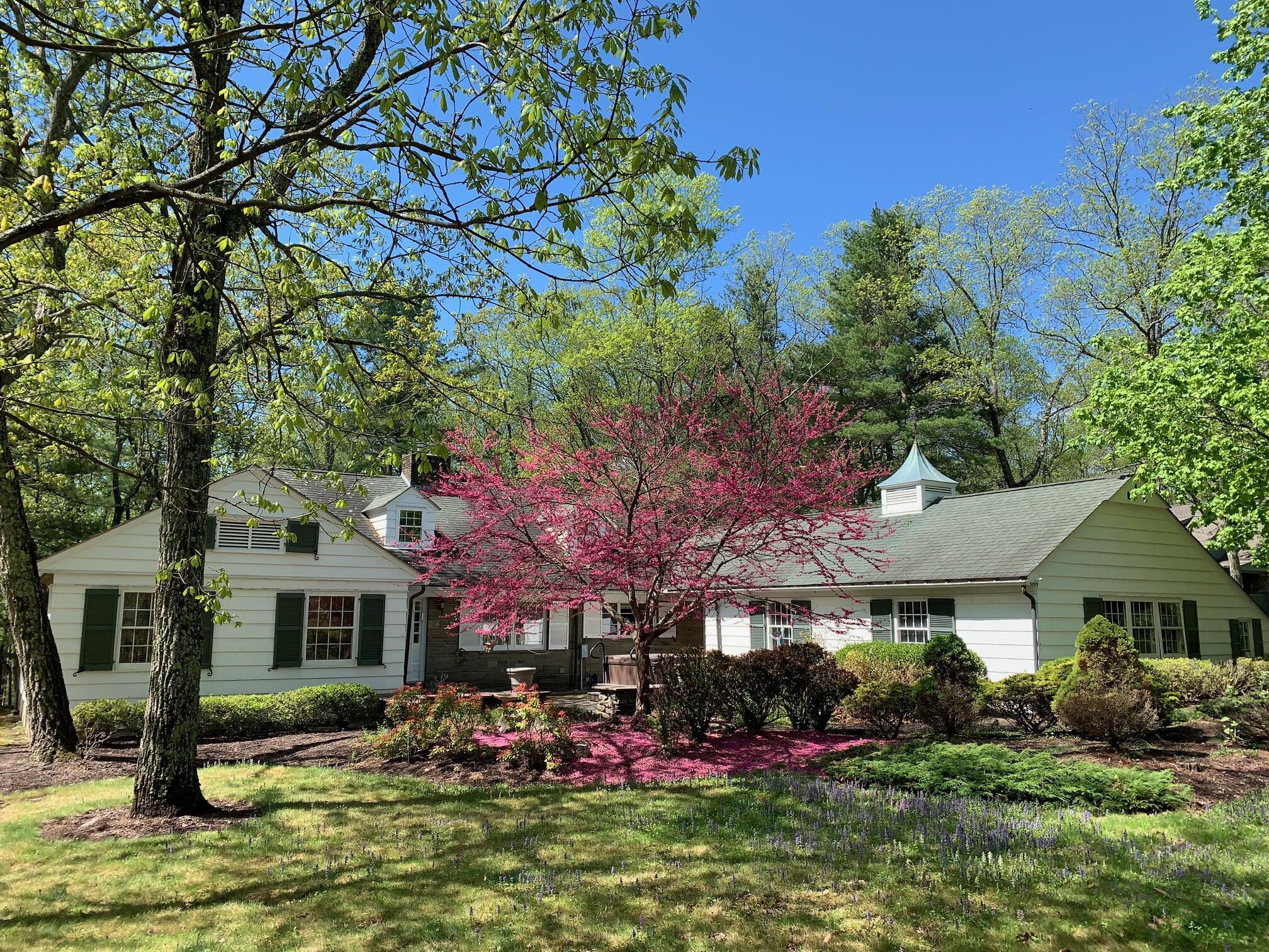 a front view of a building with sitting area
