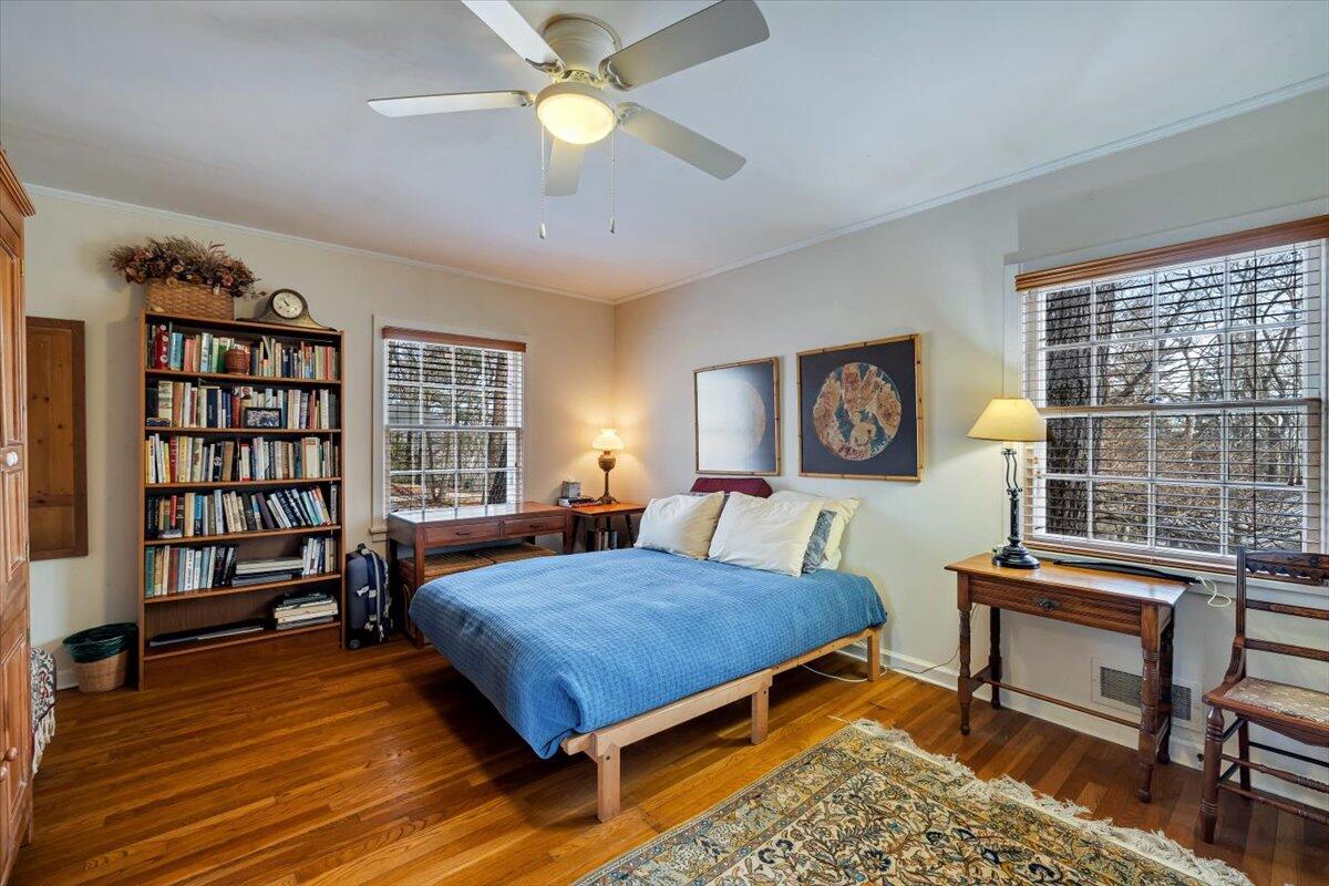 331 Summit Drive Cresco, PA 18326 - Photo 14 of 43 a bedroom with a bed a bookshelf and a bookshelf with wooden floor